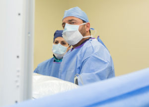 Dr. Vladimir Alexander and physican assistant in surgery