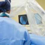 Dr. Alexander performing hip replacement surgery