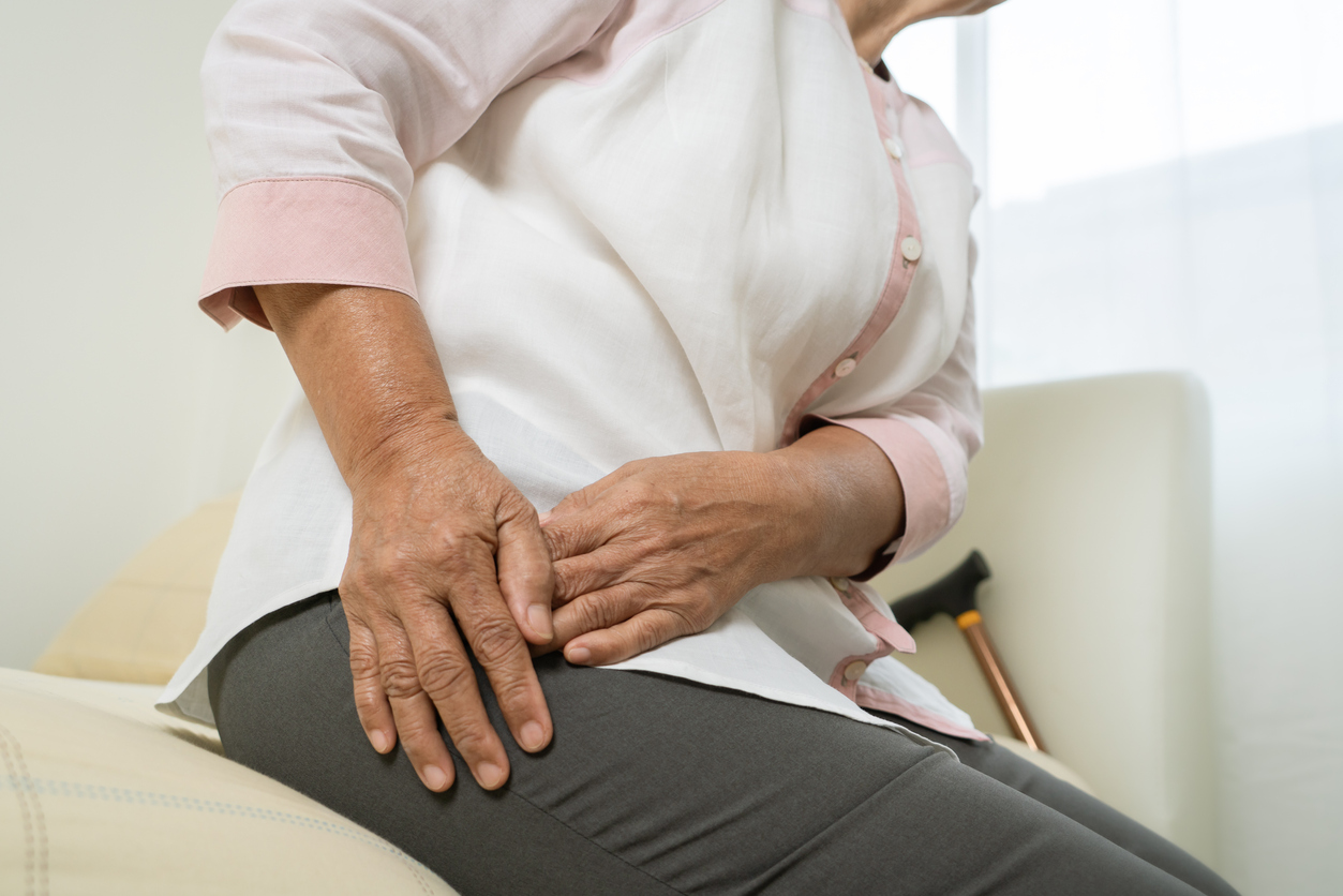 Older woman suffering from pain from hip osteoarthritis