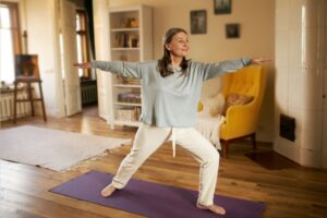 Woman moving on with her life after cervical disc replacement and practicing light yoga.