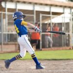Youth baseball player batting, a demographic prone to growth plate fractures