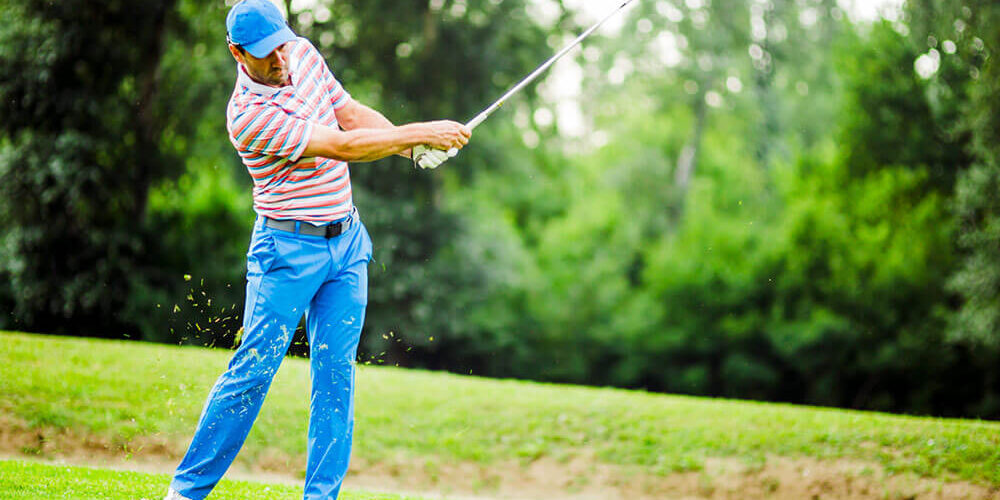 Golfer swinging a golf club